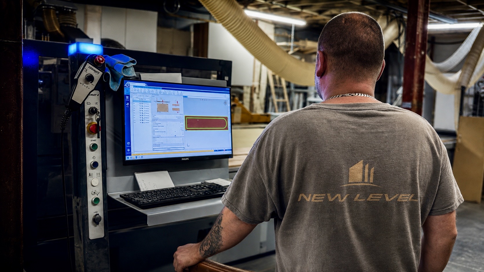 New Level workshop operator at the CNC control station
